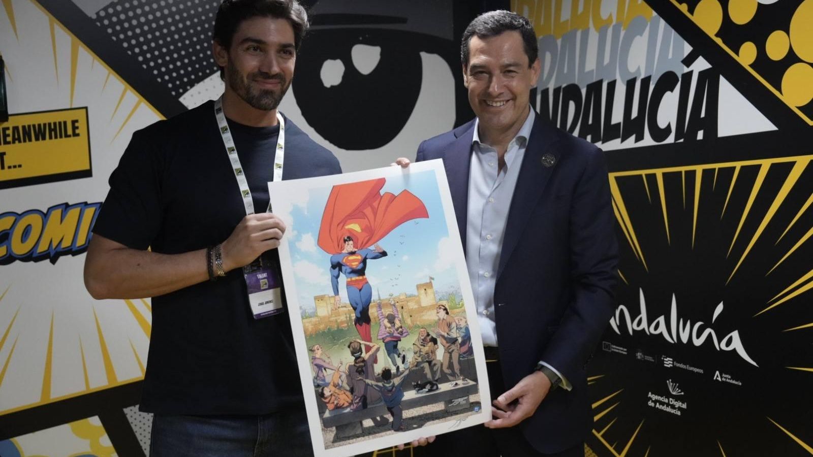 El dibujante Jorge Jiménez con el presidente de la Junta, Juanma Moreno