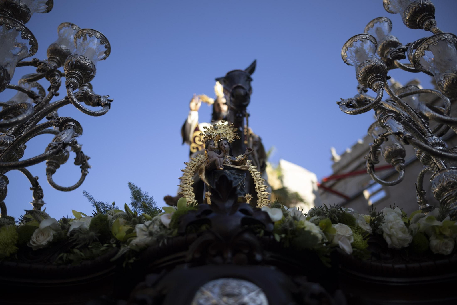 Imágenes de la salida extraordinaria de La Borriquita por las calles de Huelva