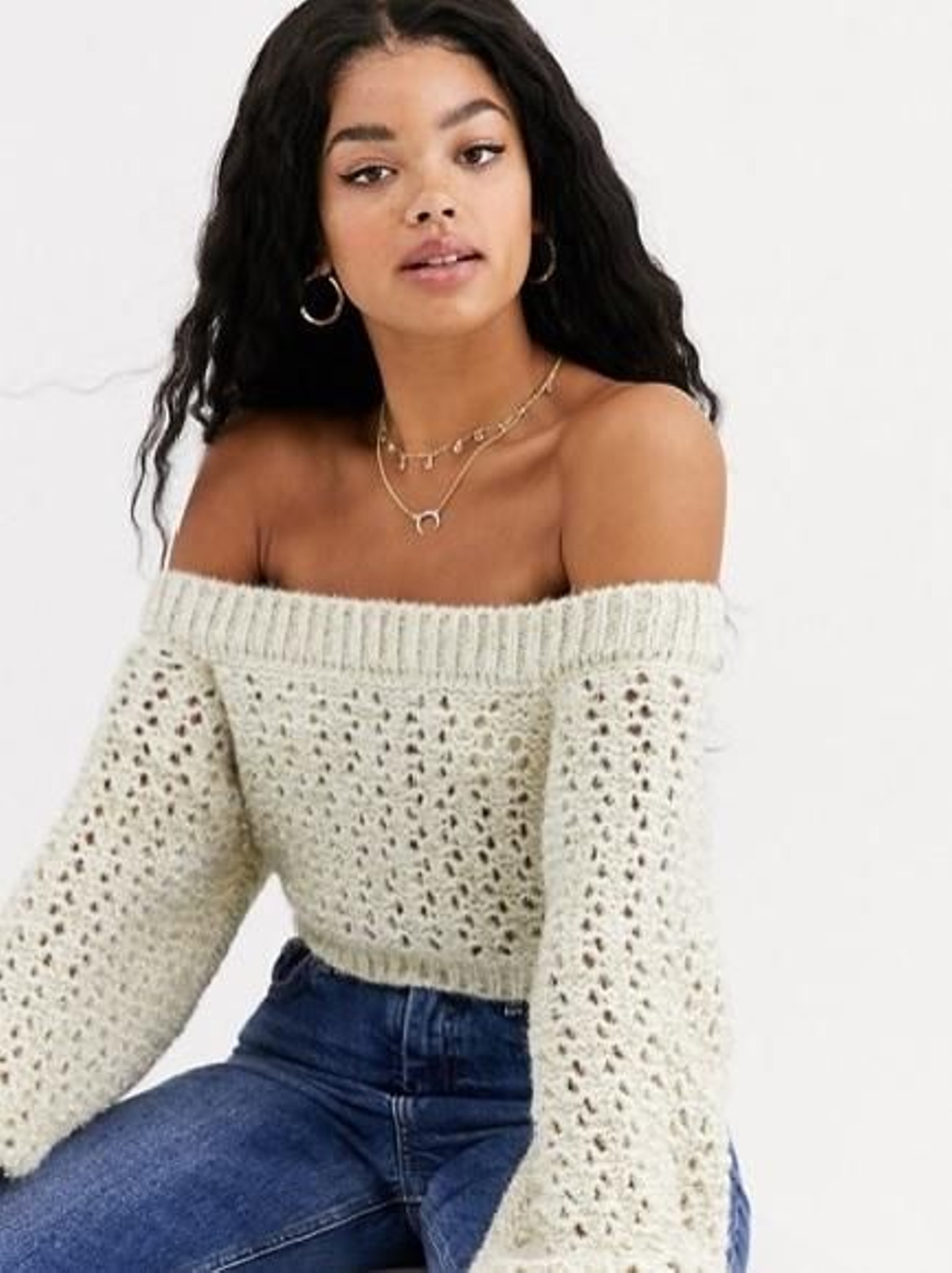 Jersey con escote Bardot y mangas voluminosas con acabado metalizado