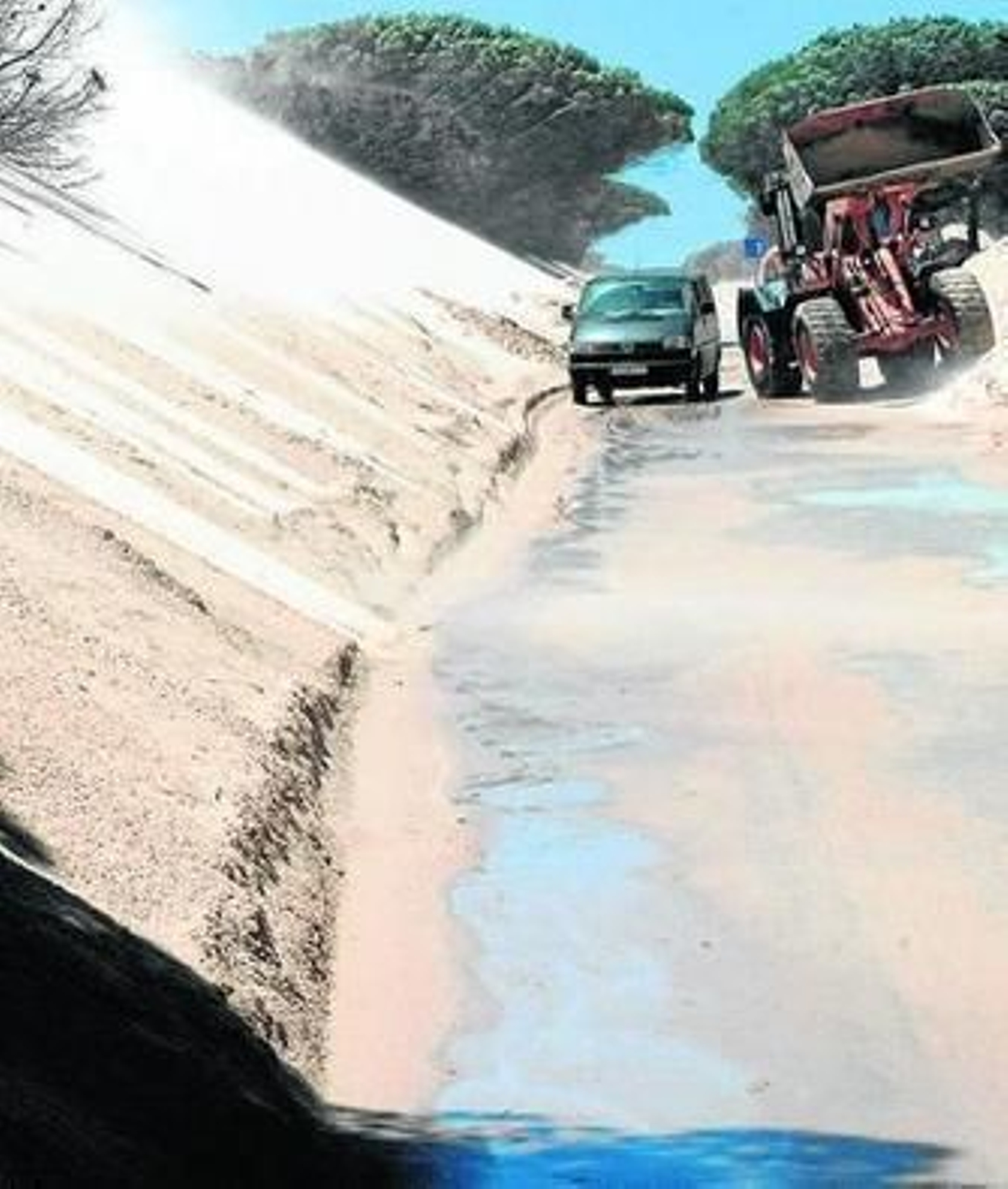 Un vehículo pasa entre la duna y una excavadora, el pasado lunes.