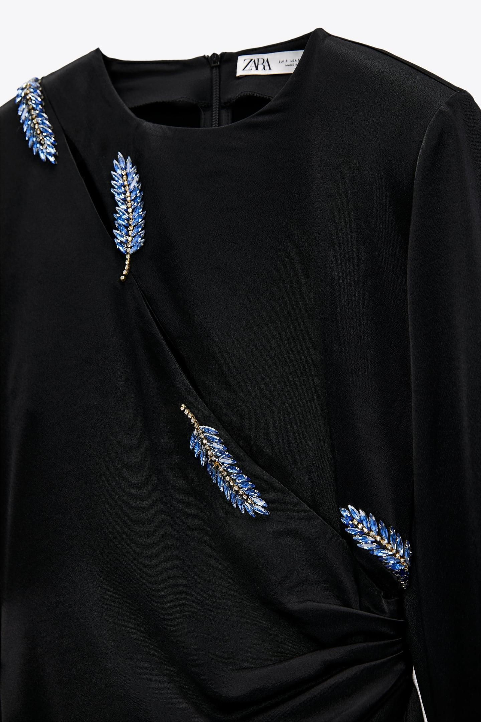 Detalle de plumas del vestido de Zara.