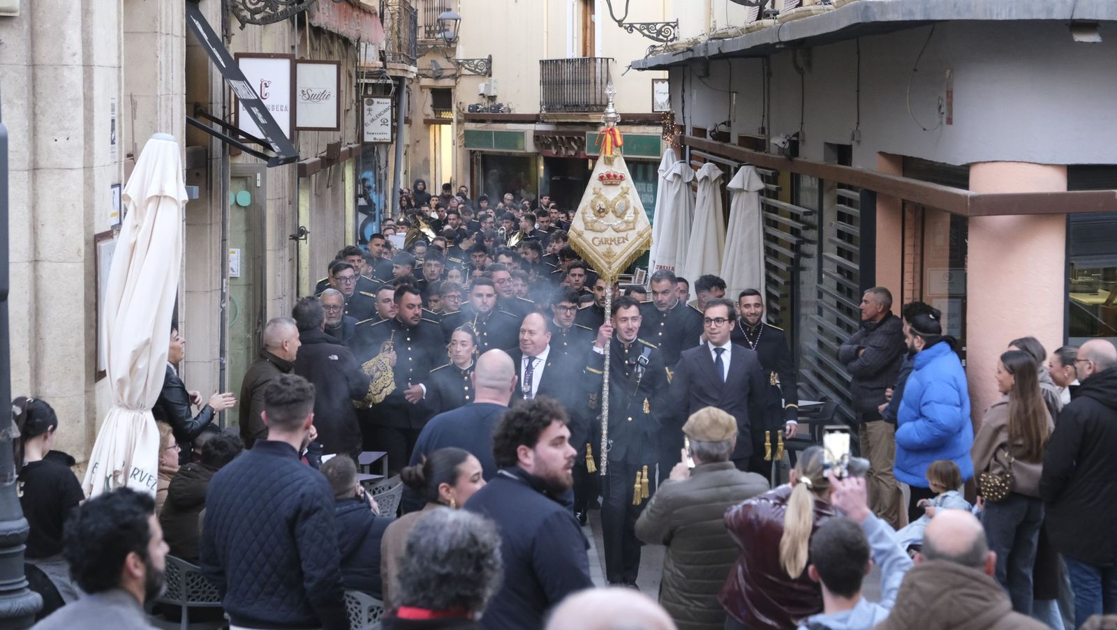 La Banda de Cornetas y Tambores Nuestra Señora del Carmen arropa al Cristo de Medinaceli, en imágenes