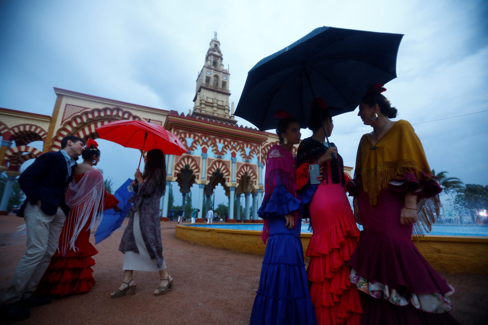 La intensa lluvia de este sábado en la Feria de Córdoba, en imágenes