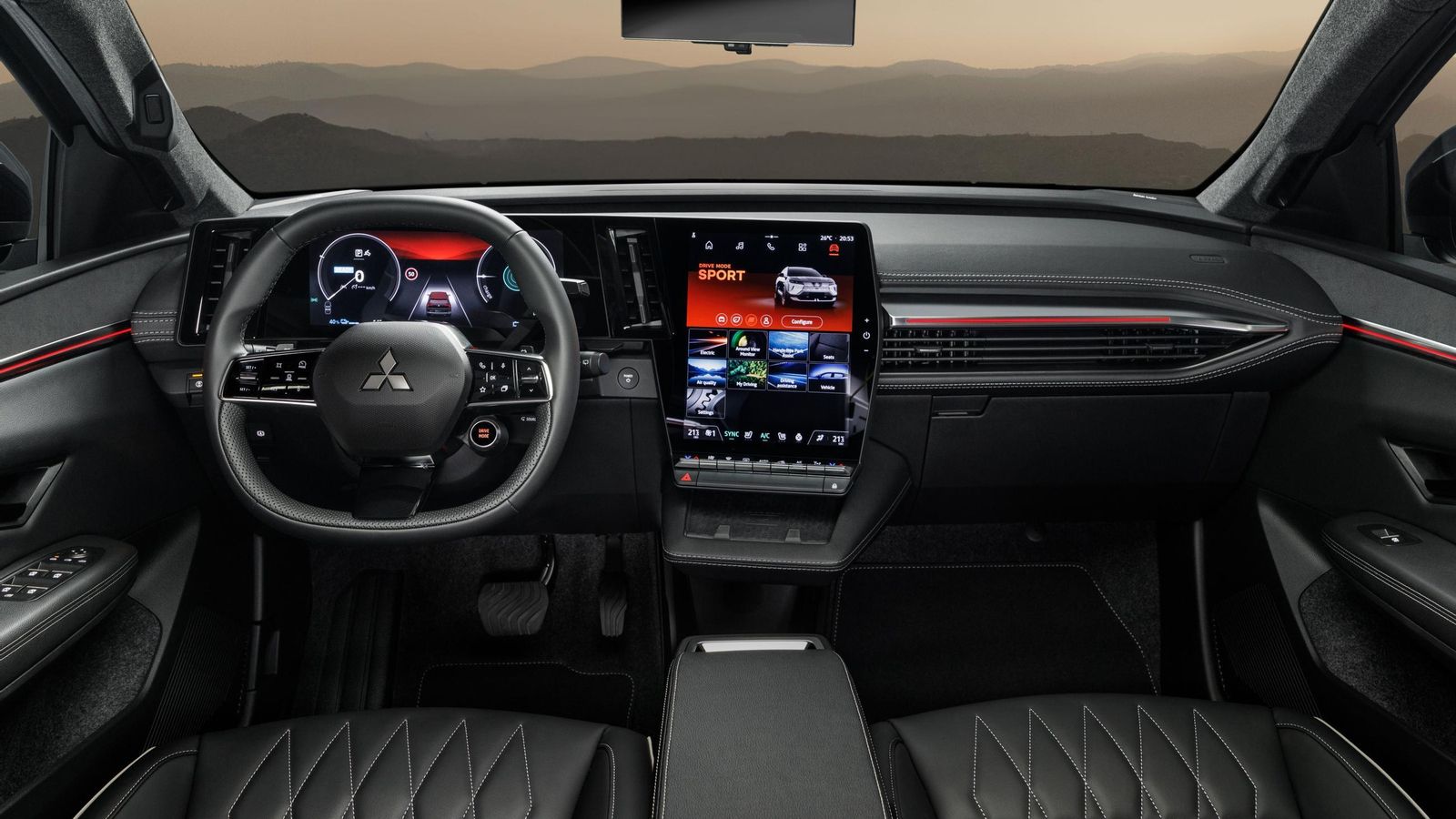 El salpicadero, salvo por el logotipo del volante, bien podría pasar por el de un Renault Scenic E-Tech.