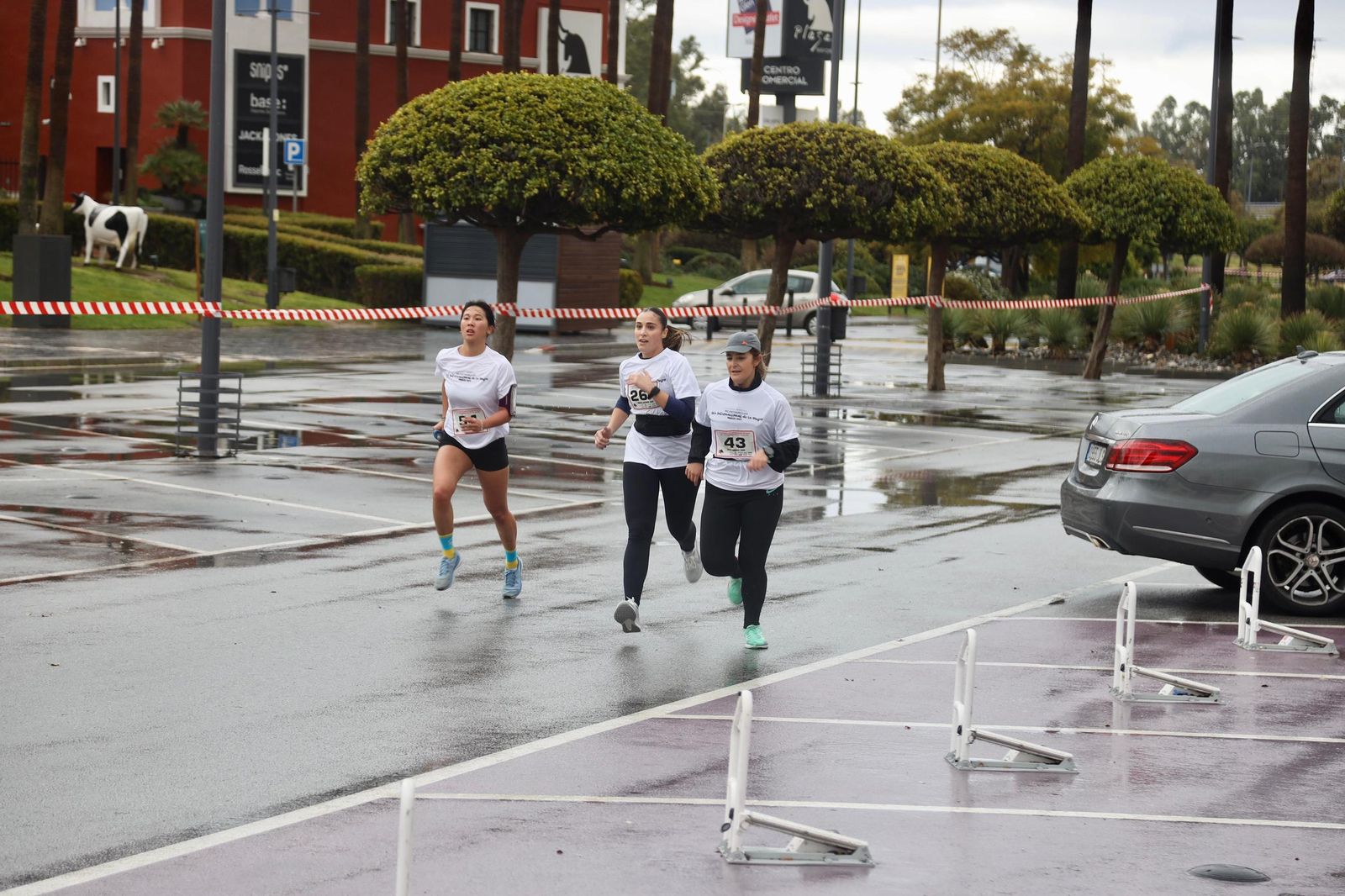 La Carrera por el Día Internacional de la Mujer en Málaga, en fotos