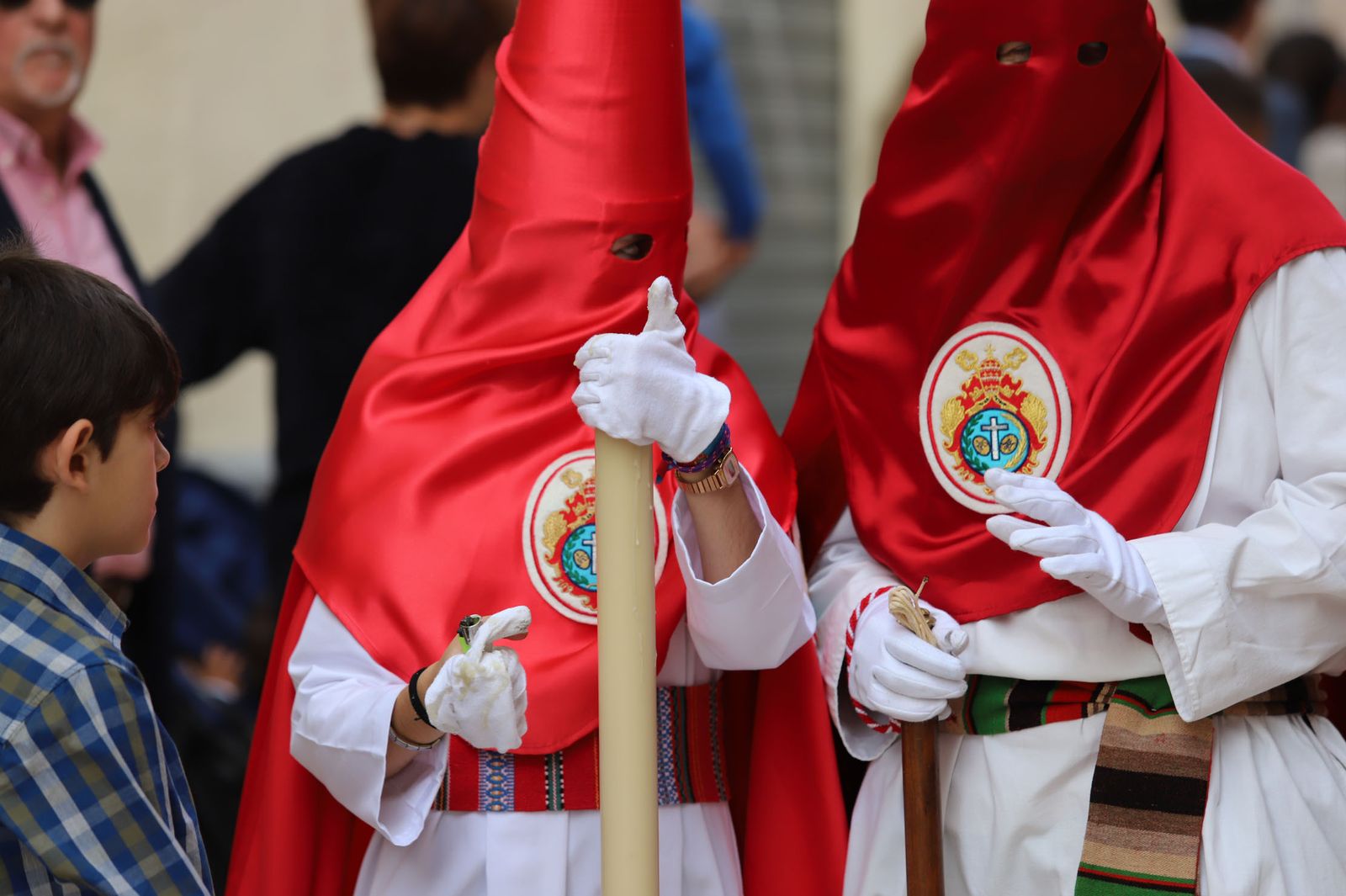 Imágenes del recorrido de la Borriquita  por las calles de Huelva