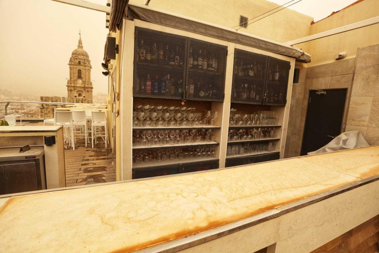 Tres años de la calima que tiñó Málaga de naranja, en imágenes