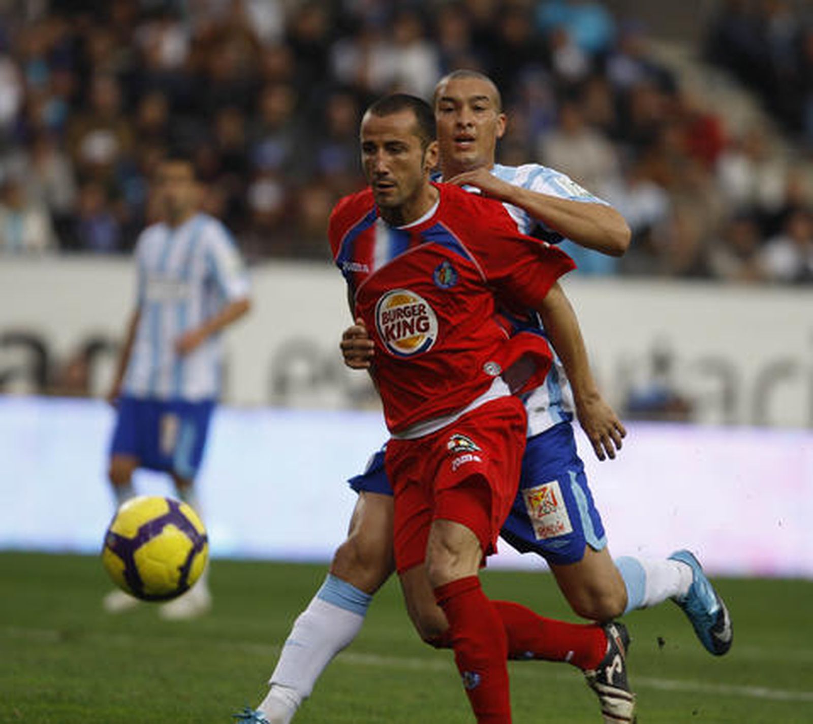 El Málaga respira tras su victoria en Liga ante el Getafe. / Sergio Camacho