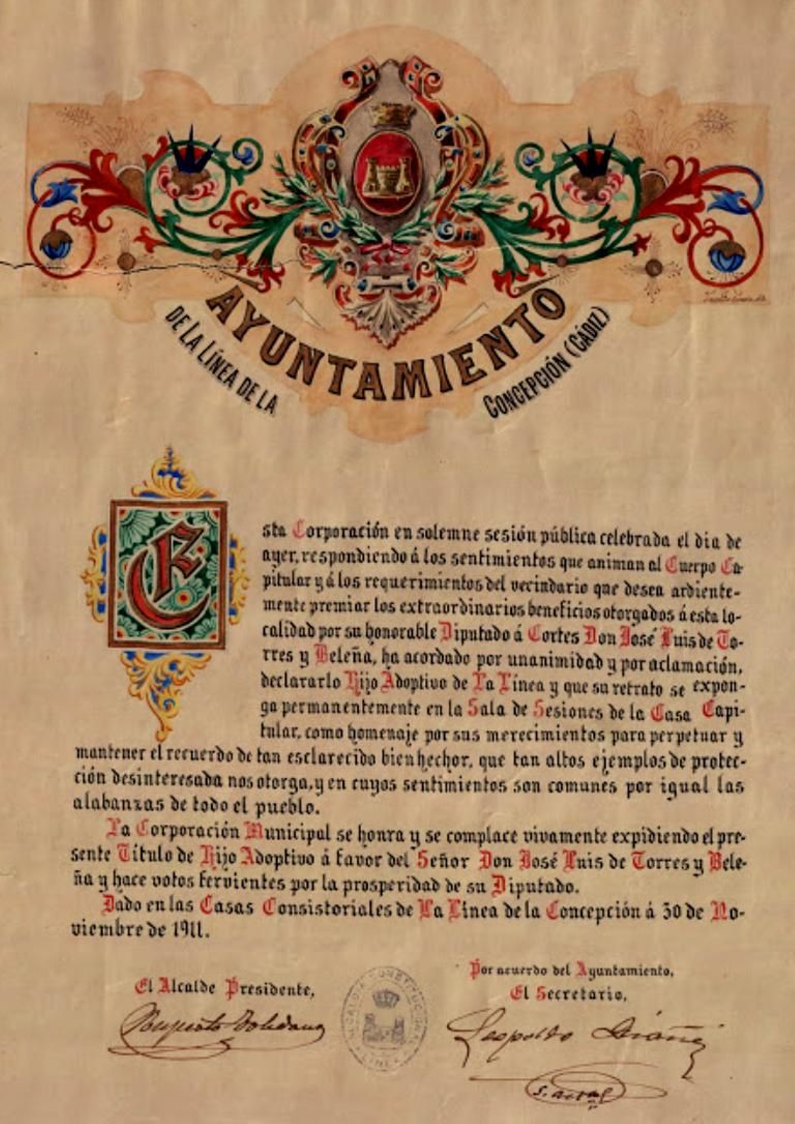 Diploma en el que se recoge la concesión, por el Ayuntamiento de La Línea de la Concepción, del título de Hijo Adoptivo de la ciudad al diputado a Cortes don José Luis de Torres Beleña, el 30 de noviembre de 1911. Diploma en el que se recoge la concesión, por el Ayuntamiento de La Línea de la Concepción, del título de Hijo Adoptivo de la ciudad al diputado a Cortes don José Luis de Torres Beleña, el 30 de noviembre de 1911.
