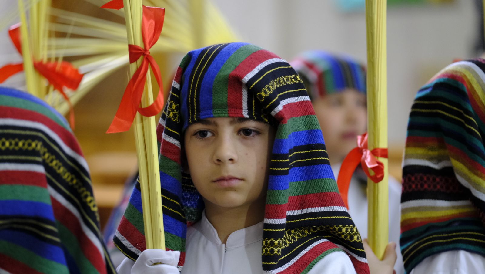 La Borriquita procesiona por las calles de Almería, en imágenes