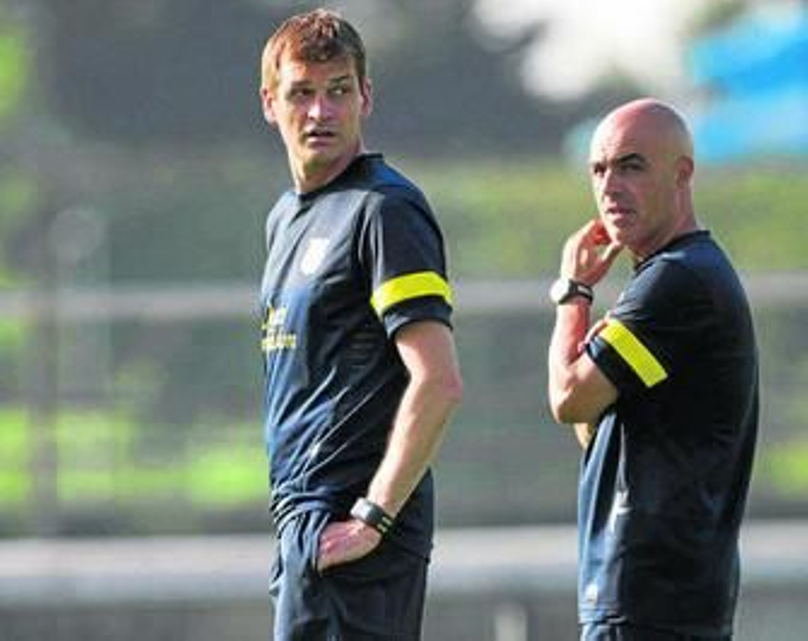Tito Vilanova, junto a su preparador físico, Juanjo Brau, en un entrenamiento.