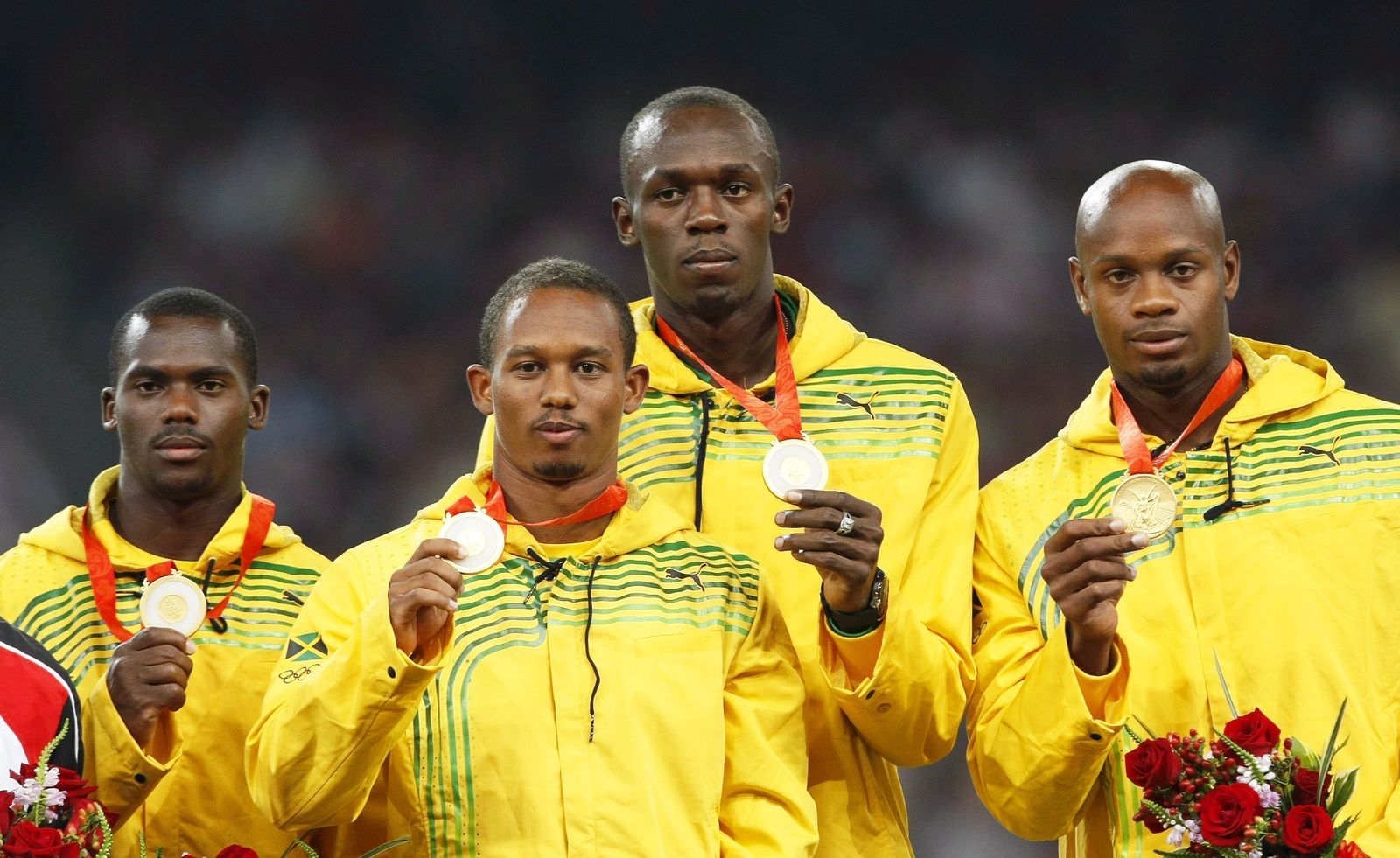Nesta Carter, Michael Frater, Usain Bolt y Asafa Powell, en el podio de Pekín 2008.