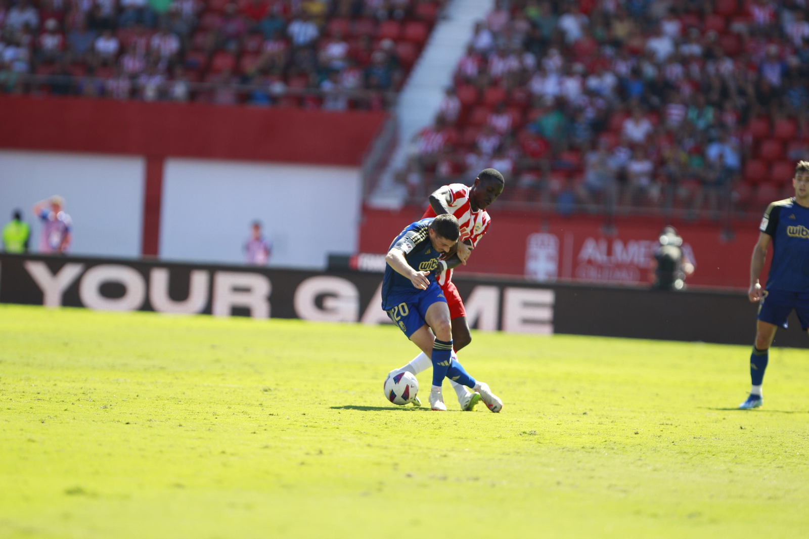 Imágenes del empate a 3 de la U.D. Almería y el Granada C.F.