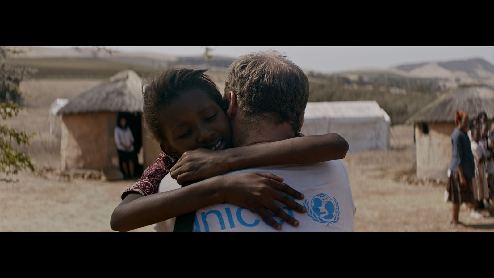 Parte del equipo de Unicef Andalucía con Enrique Sánchez, ayer a las puertas de la sede sevillana de la organización.