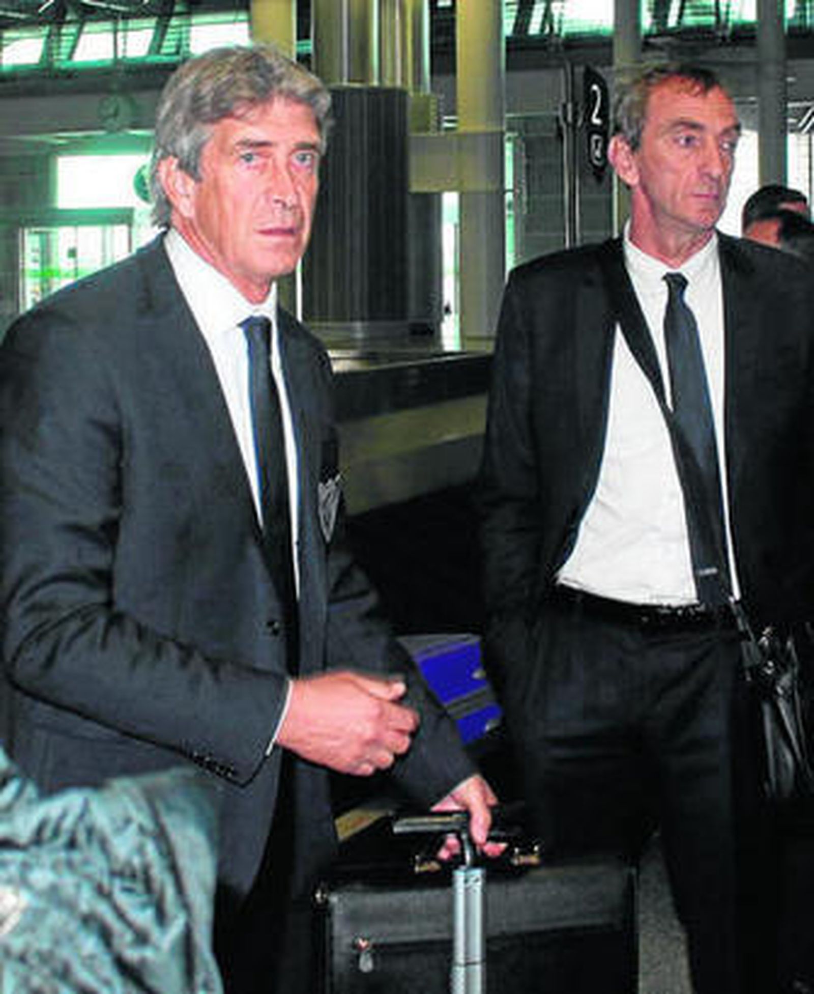 Pellegrini y Cousillas al aterrizar en Oporto.