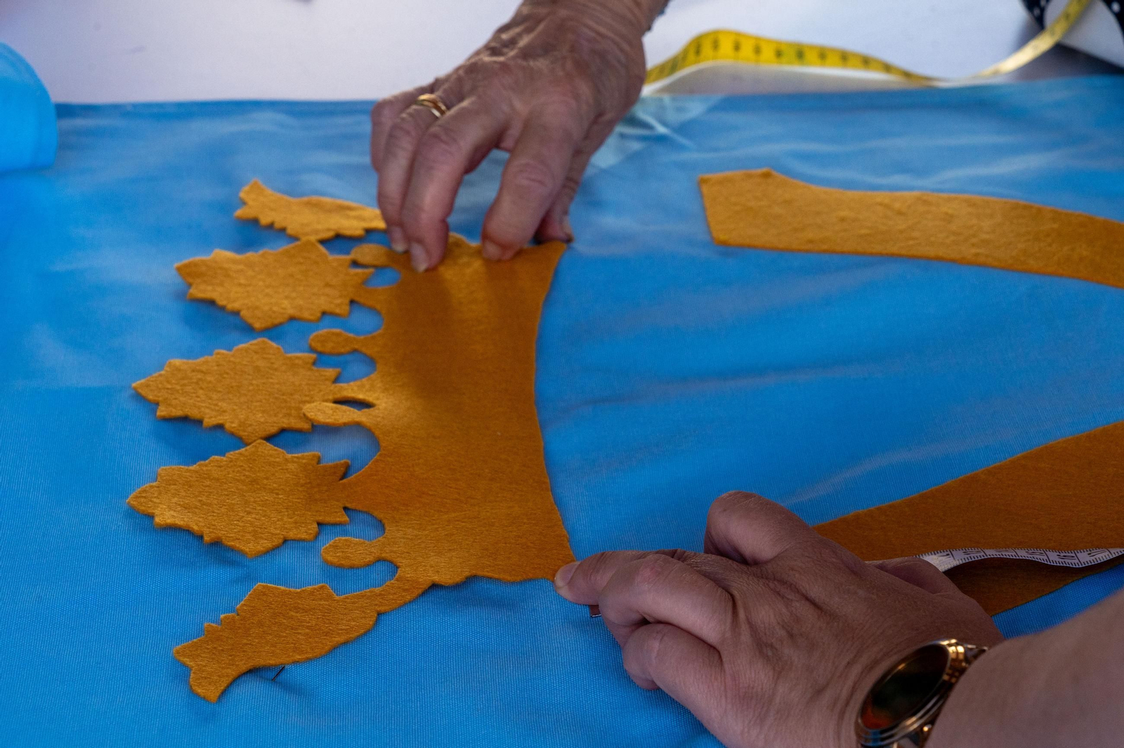 Imágenes de los talleres de la Hermandad de la Victoria de las decoraciones para La Magna Mariana
