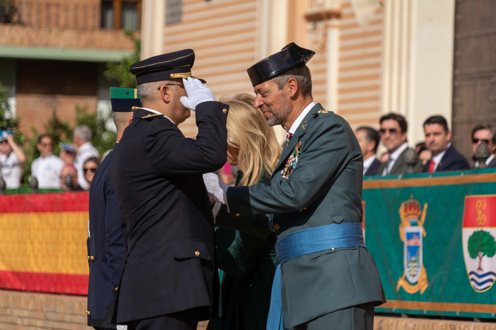 Imágenes del desfile de la Guardia Civil en el Día de la Hispanidad y de su patrona en la Plaza de La Merced