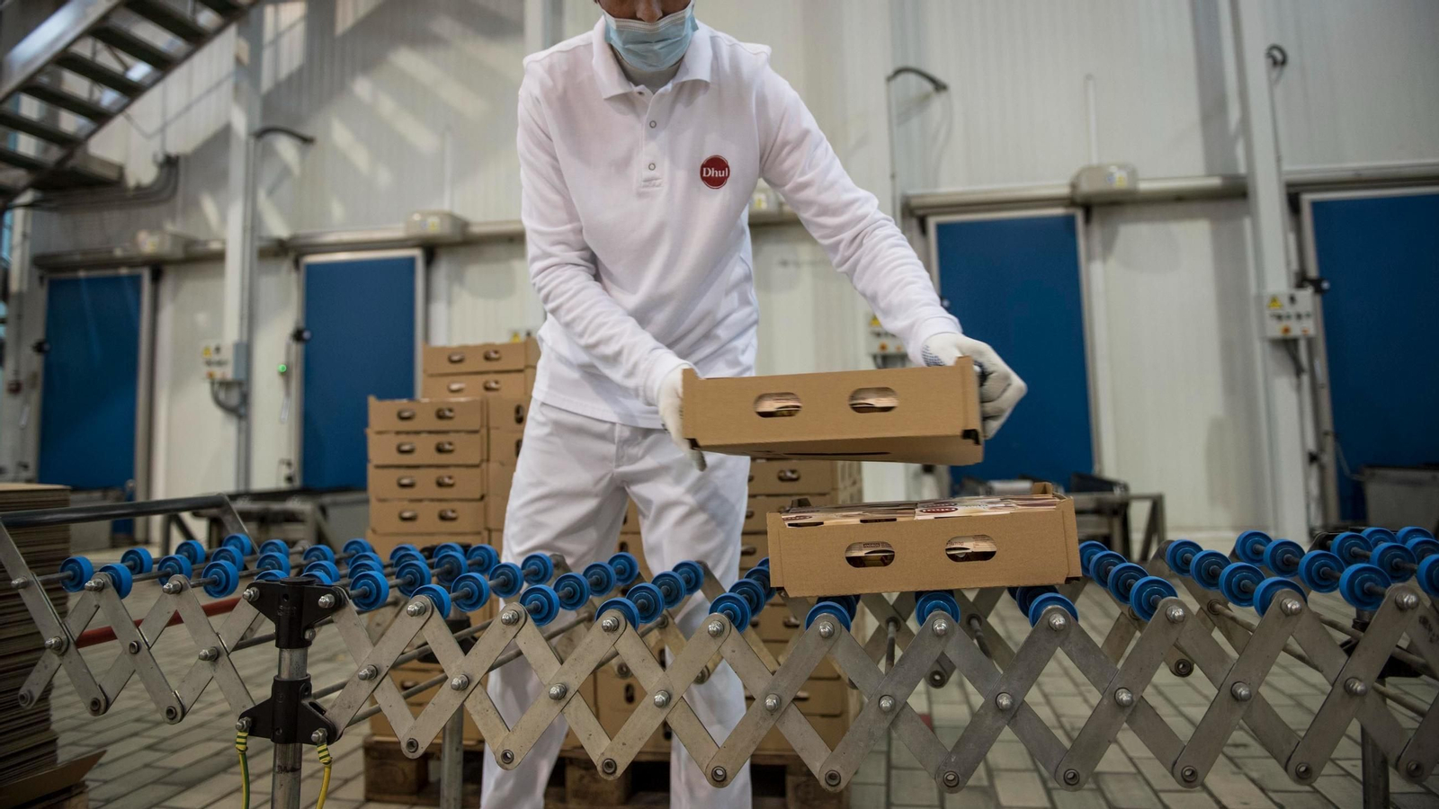 Un trabajador en Dhul | Imagen de archivo