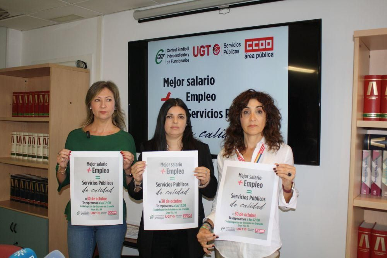 Las tres dirigentes de los sindicatos en Granada.