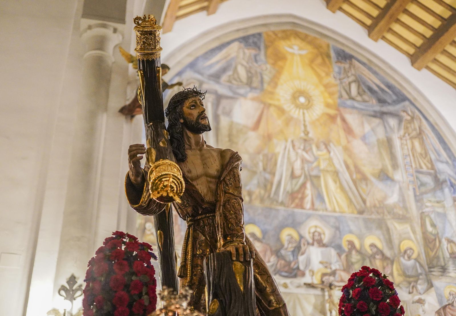 El vía crucis de la Hermandad del Trabajo, en imágenes