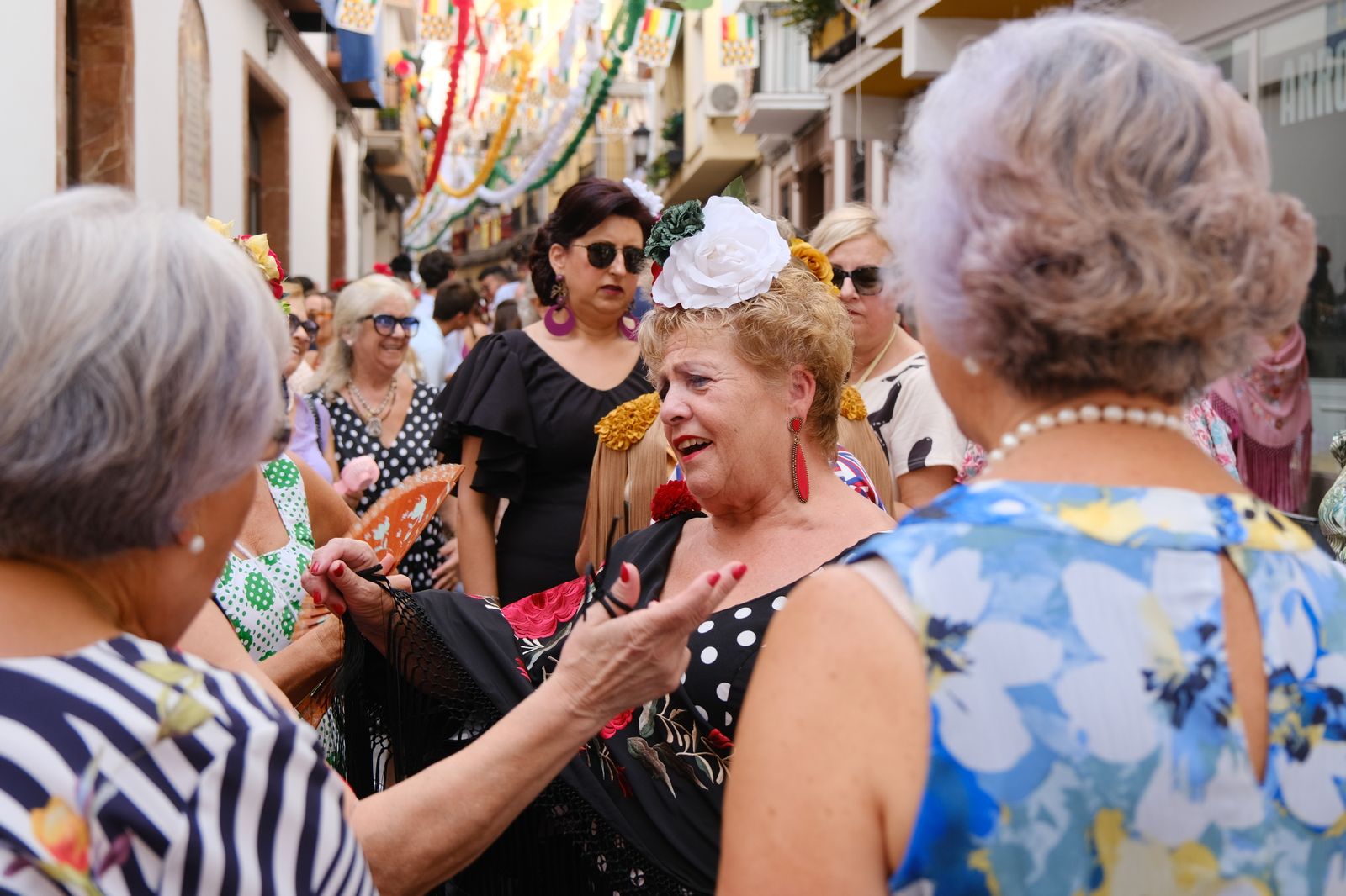 La celebración en Cabra del Día de la Mujer con motivo de la Real Feria, en imágenes