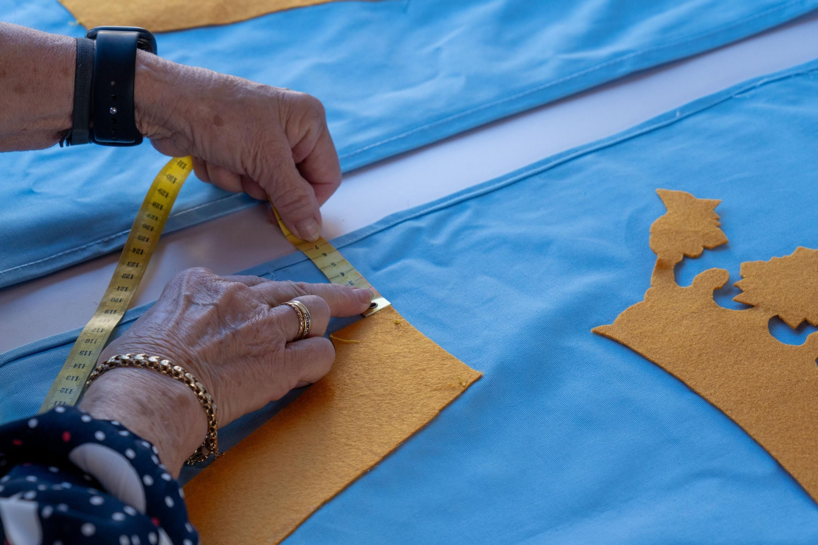 Imágenes de los talleres de la Hermandad de la Victoria de las decoraciones para La Magna Mariana
