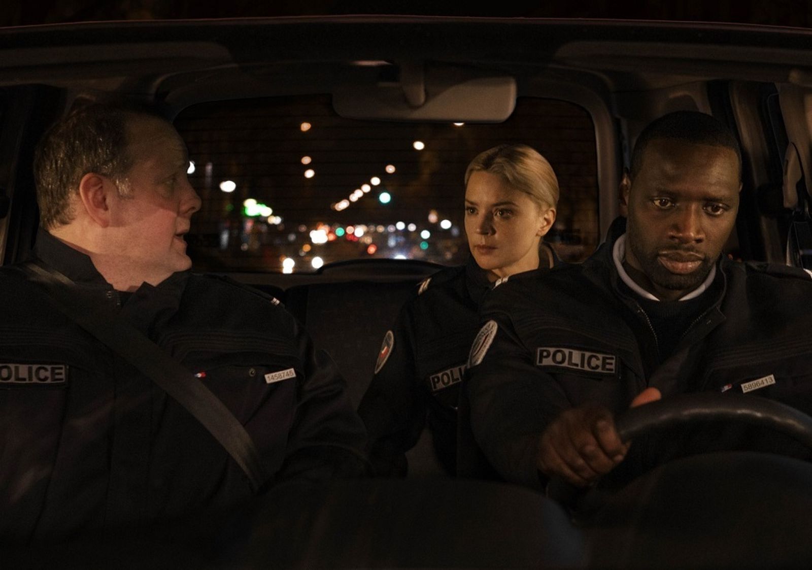 Grégory Gadebois, Virginie Efira y Omar Sy en una imagen de 'Police'.
