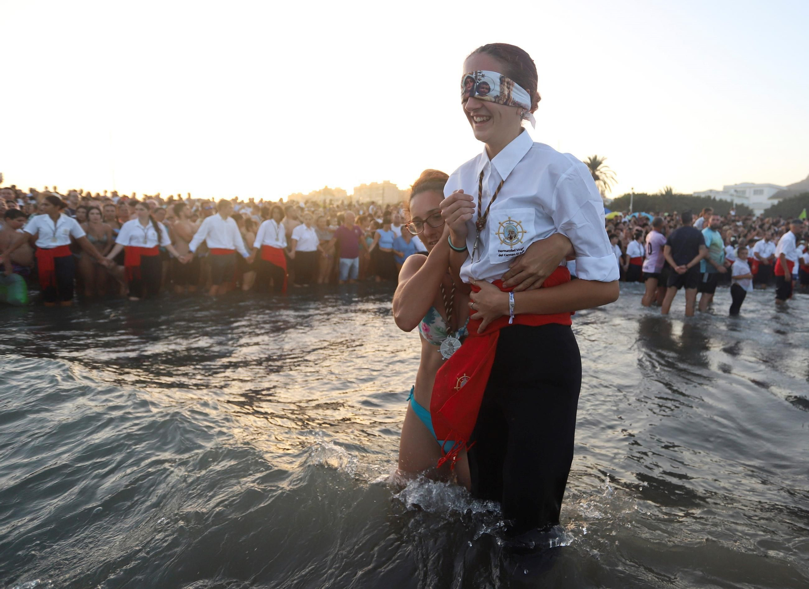 La procesión de la Virgen del Carmen en la playa del Palo, en Málaga, en fotos