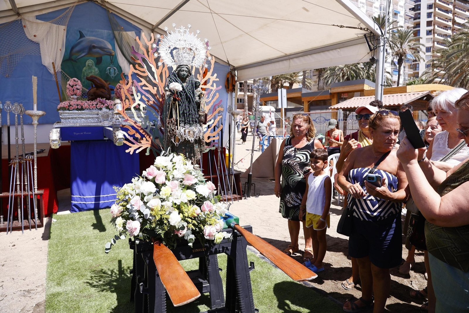 La procesión en Málaga de la Virgen del Carmen de los submarinistas, en imágenes