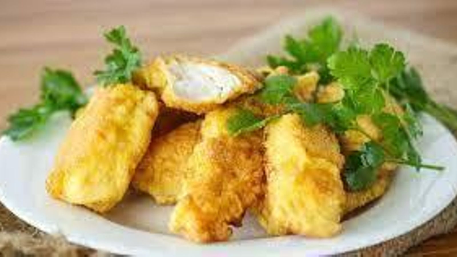 Pollo rebozado con polenta.