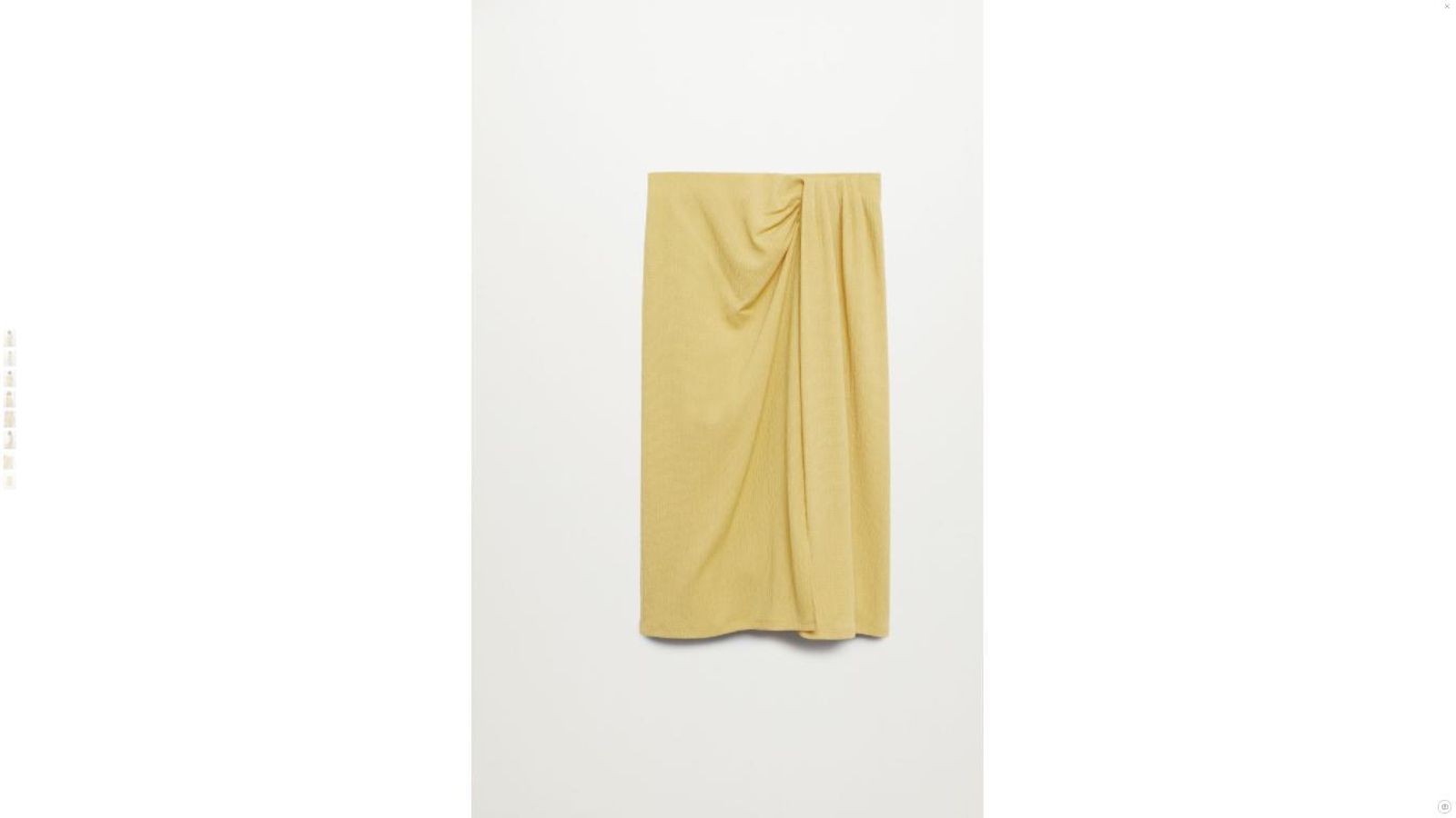 La falda midi de Mango en color mostaza.