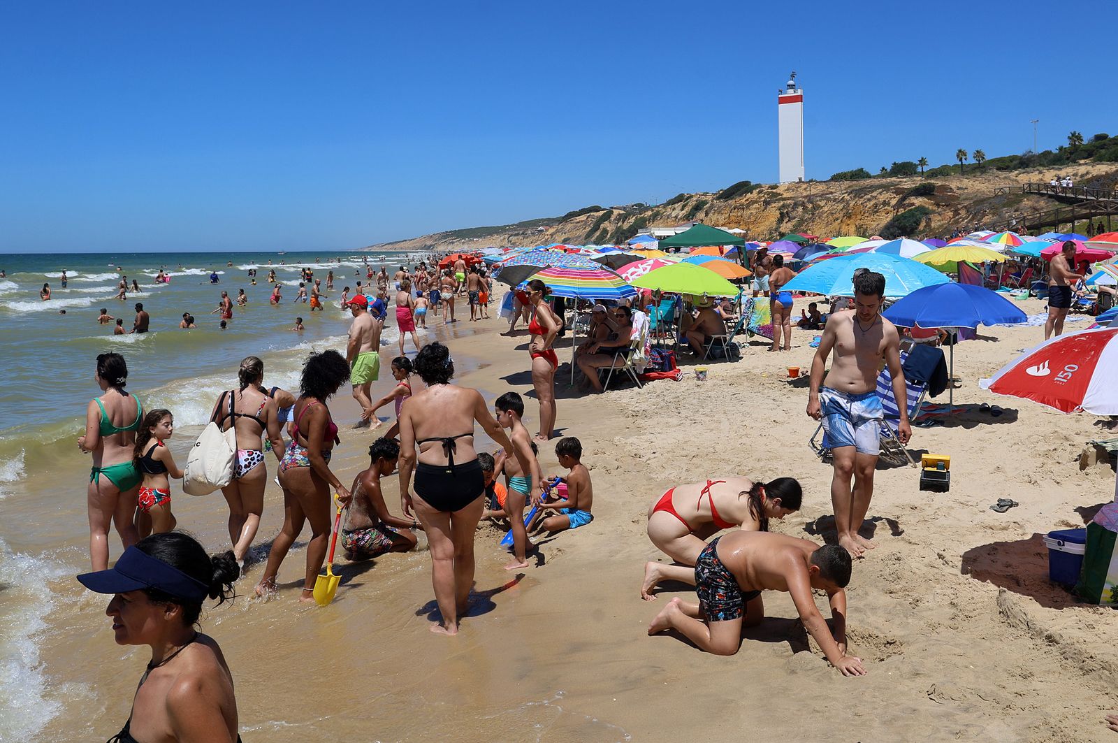 Imágenes de una mañana de calor y playa en Matalascañas