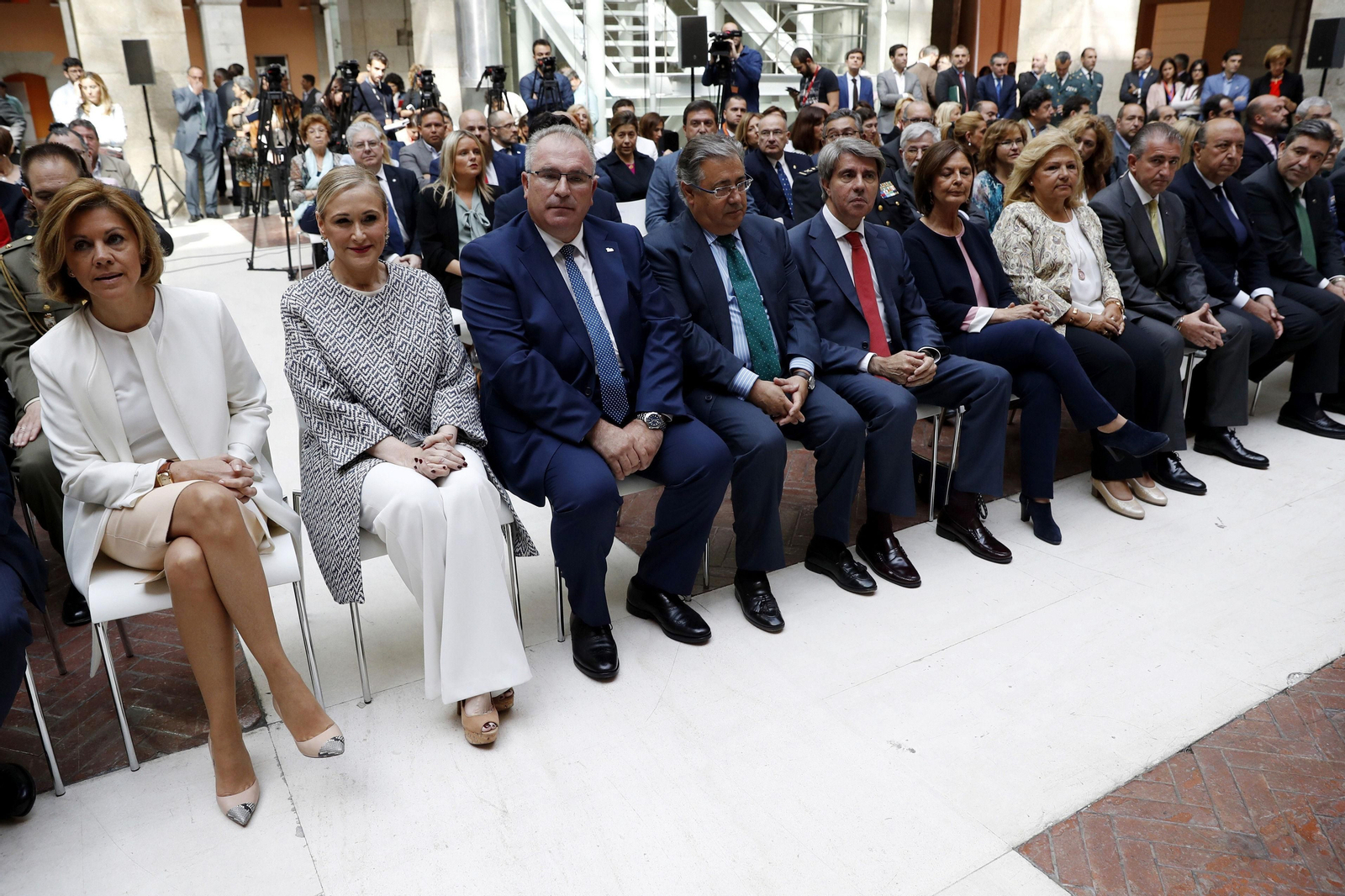María Dolores de Cospedal, Cristina Cifuentes y Juan Ignacio Zoido, durante un acto celebrado ayer en la Casa de Correos de Madrid.