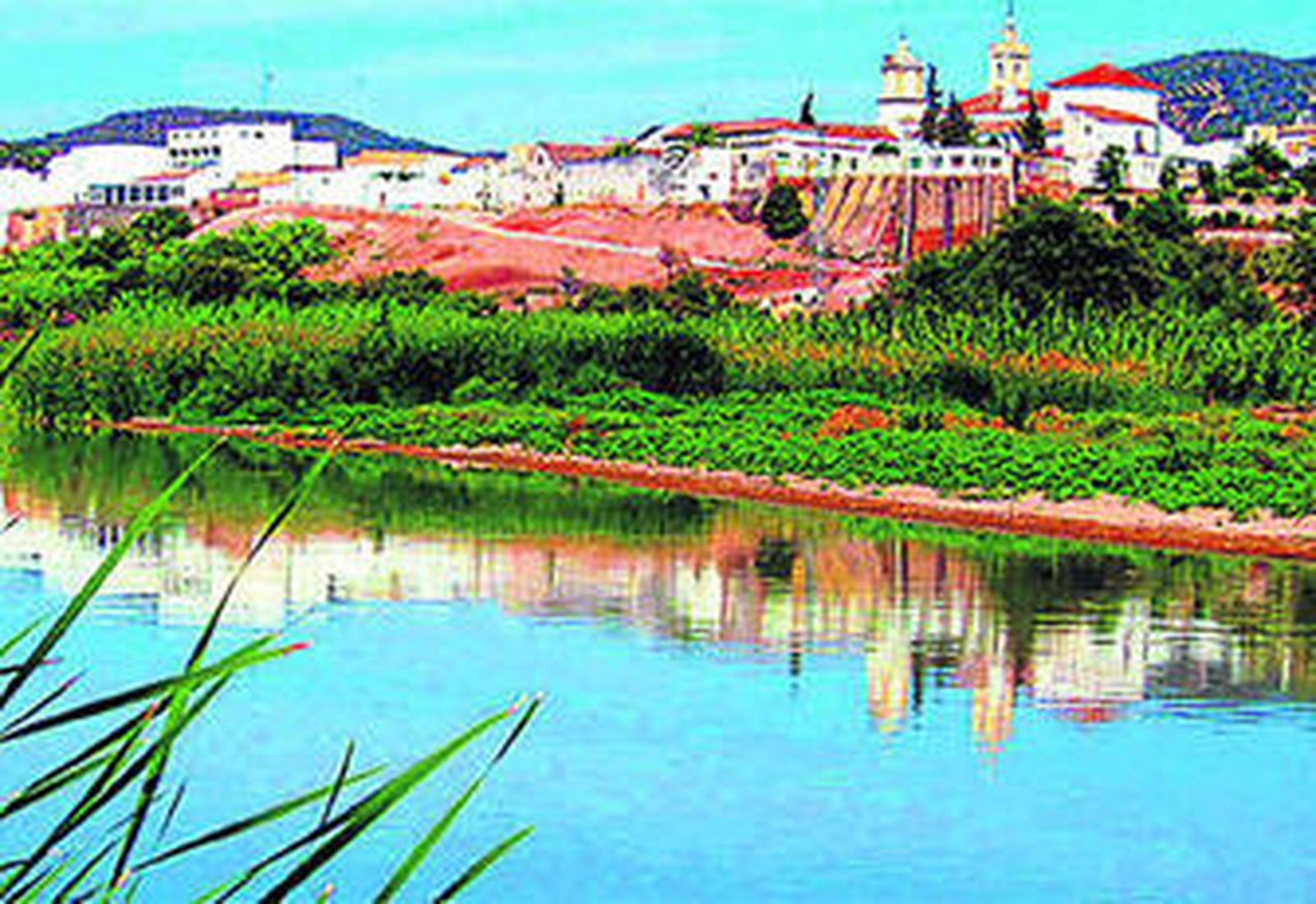 Una imagen del pueblo de Puerto Serrano, con el río en primer término.