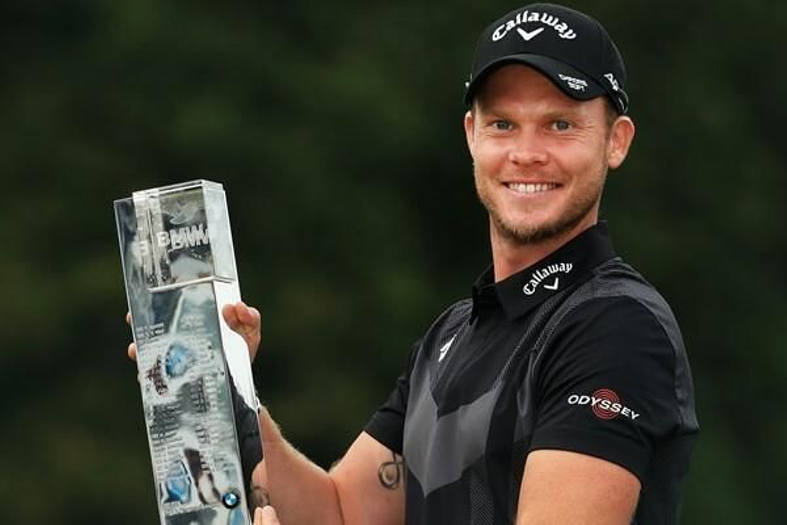 Danny Willett, con su trofeo de vencedor del BMW