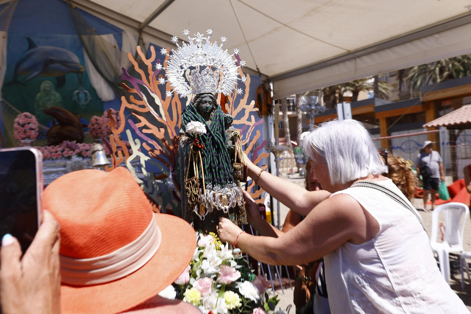 La procesión en Málaga de la Virgen del Carmen de los submarinistas, en imágenes