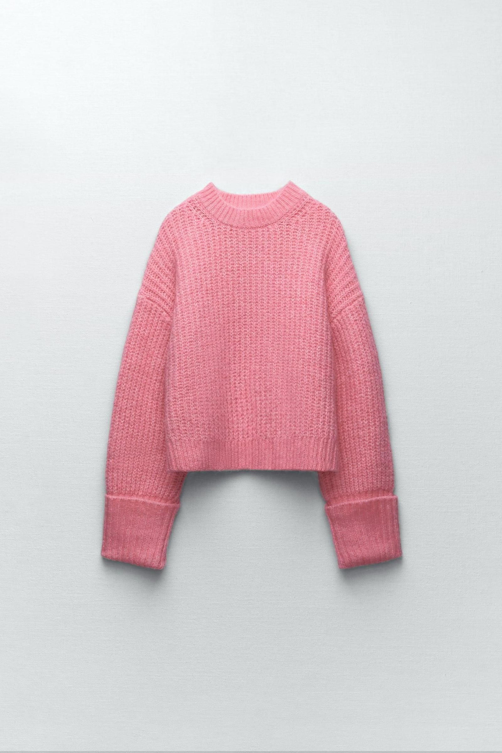 Jersey rosa de punto perlado de Zara.