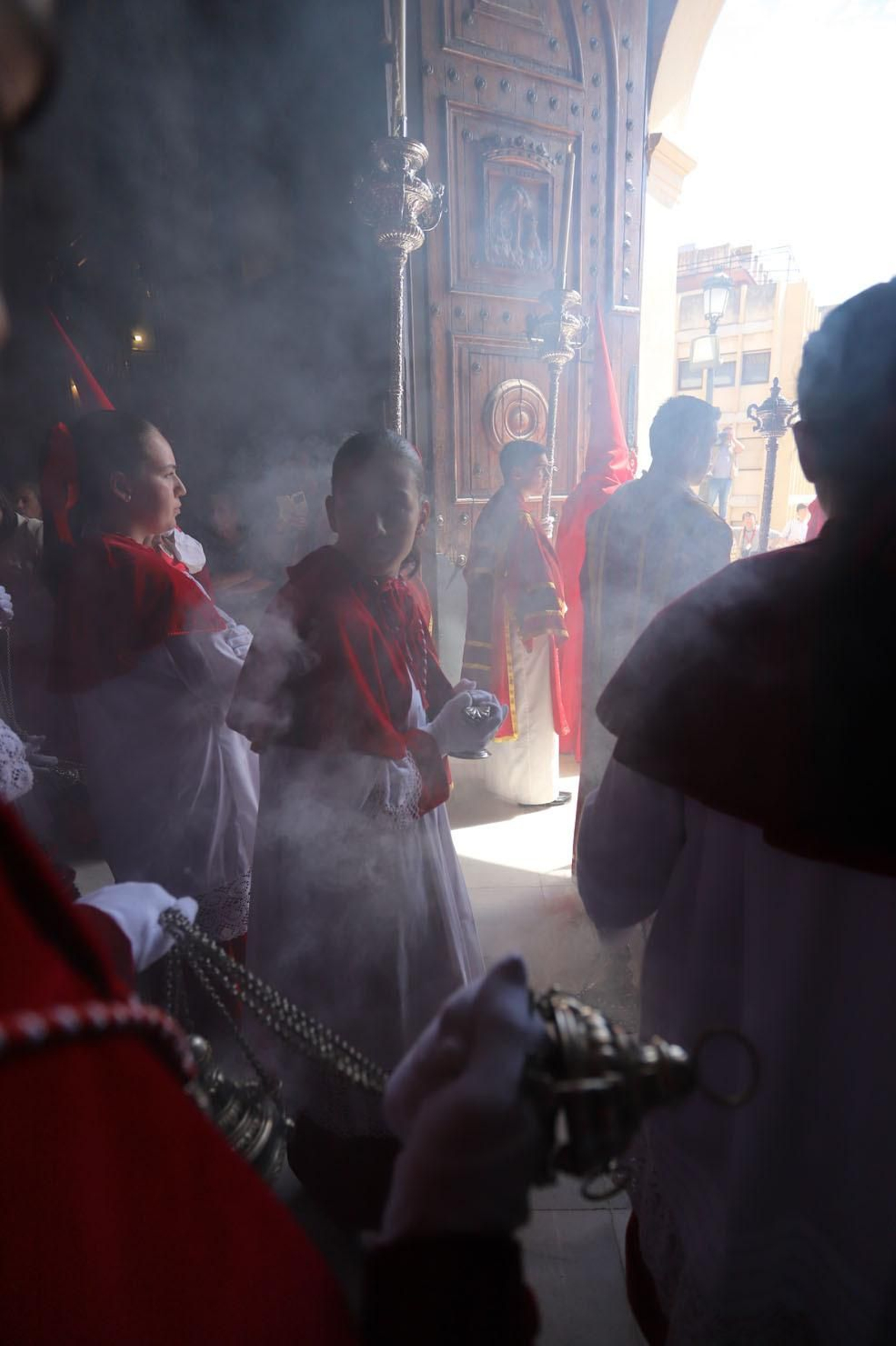 Imágenes del recorrido de la Borriquita  por las calles de Huelva