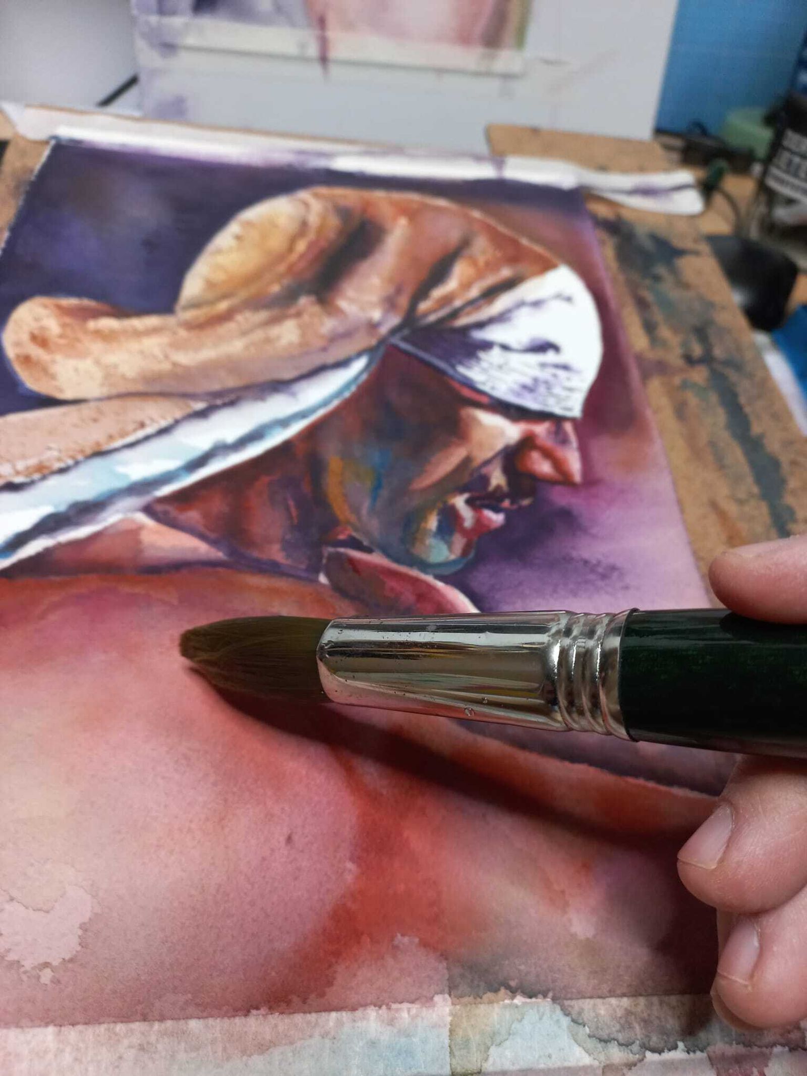 El estudio de Nicolás, terminando unos cuadros de costaleros.