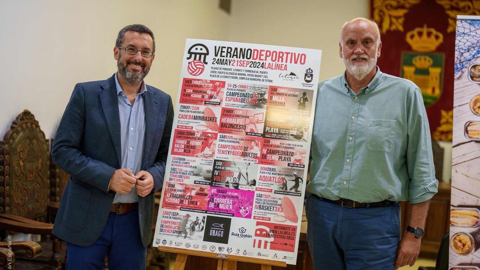 Juan Franco y Javier Vidal, junto al cartel del evento.