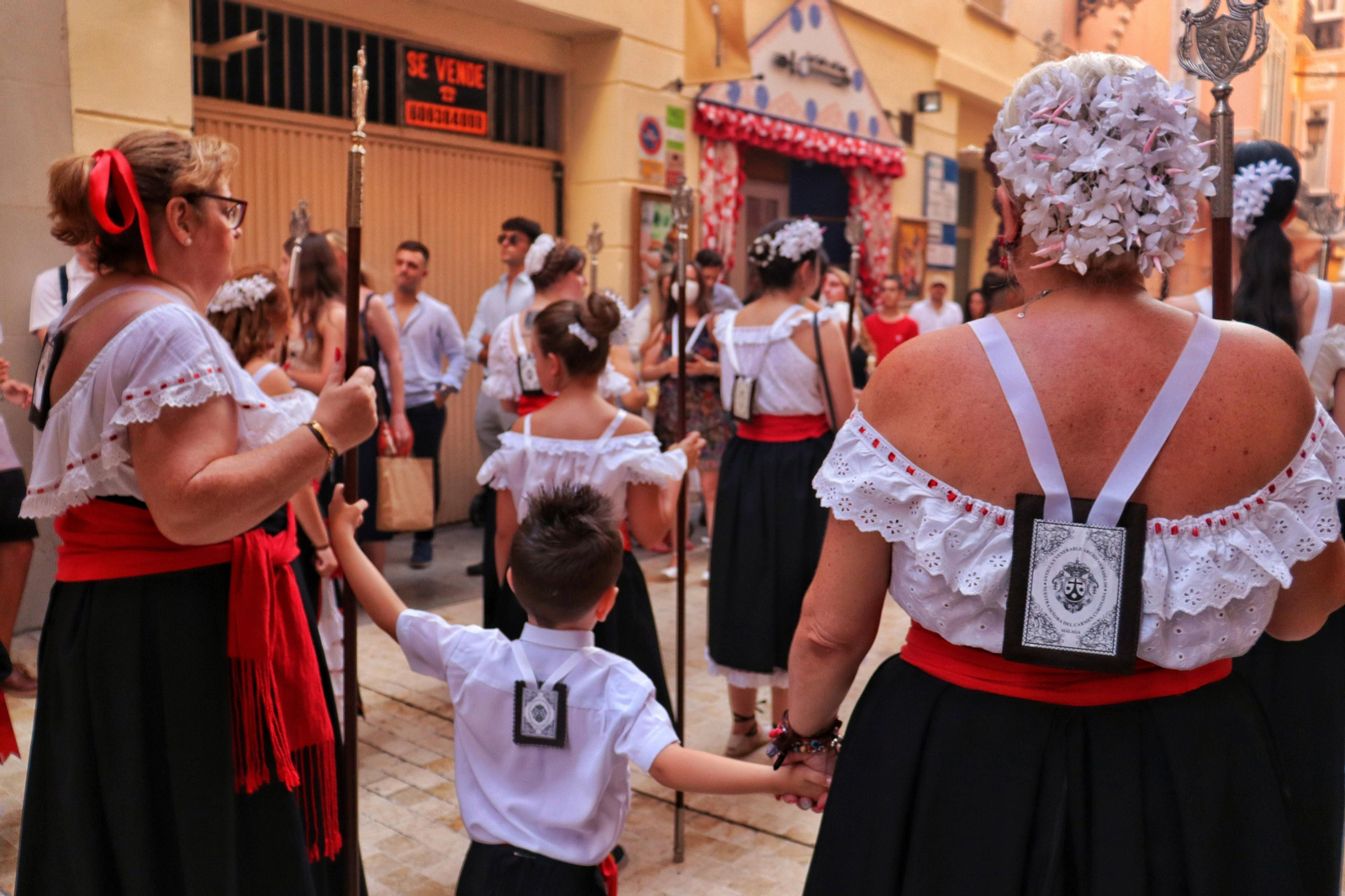 Embarque y procesión de la Virgen del Carmen del Perchel, en fotos
