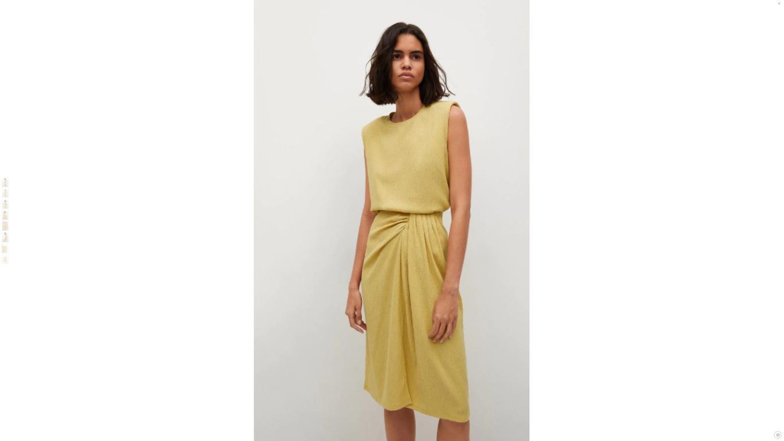 La falda midi de Mango en color mostaza.