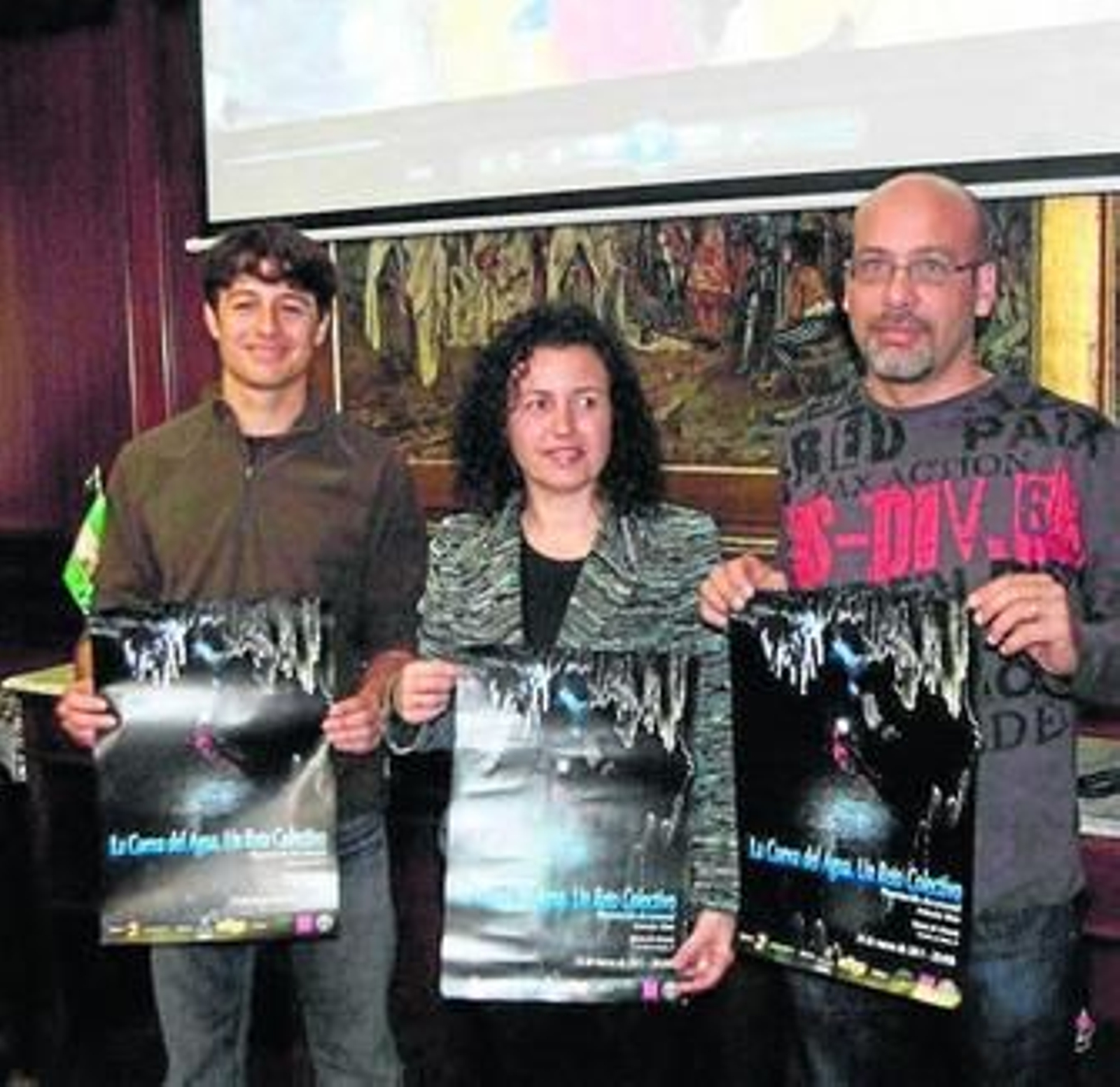 Caridad Herrerías entre David Aguirre y Emilio Zaragoza.