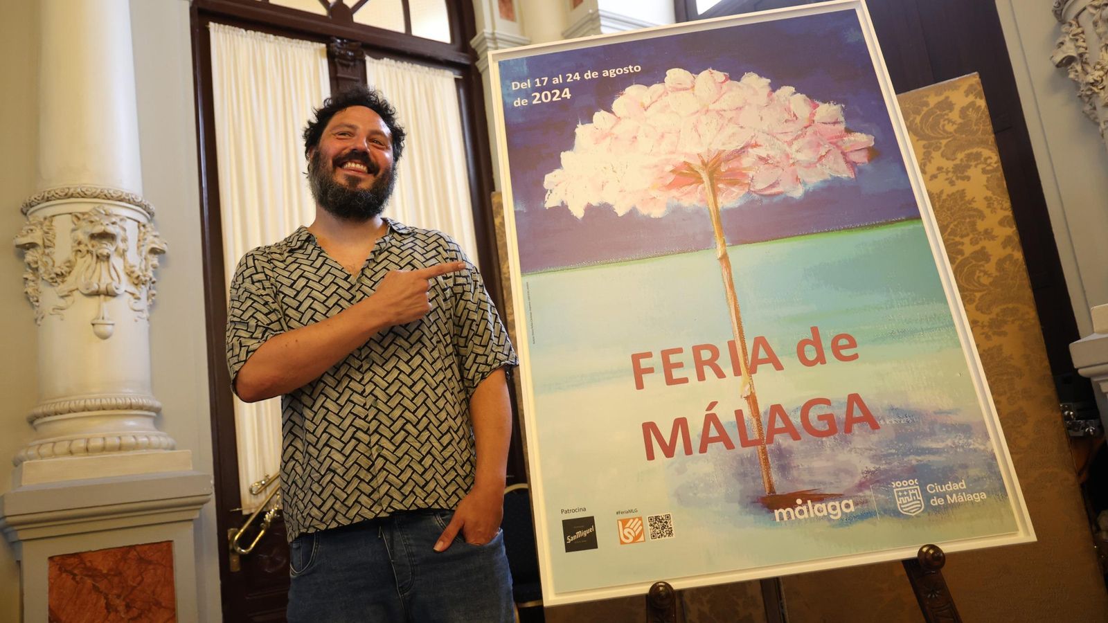 El Kanka junto al cartel de la Feria de Málaga 2024. El Kanka junto al cartel de la Feria de Málaga 2024.