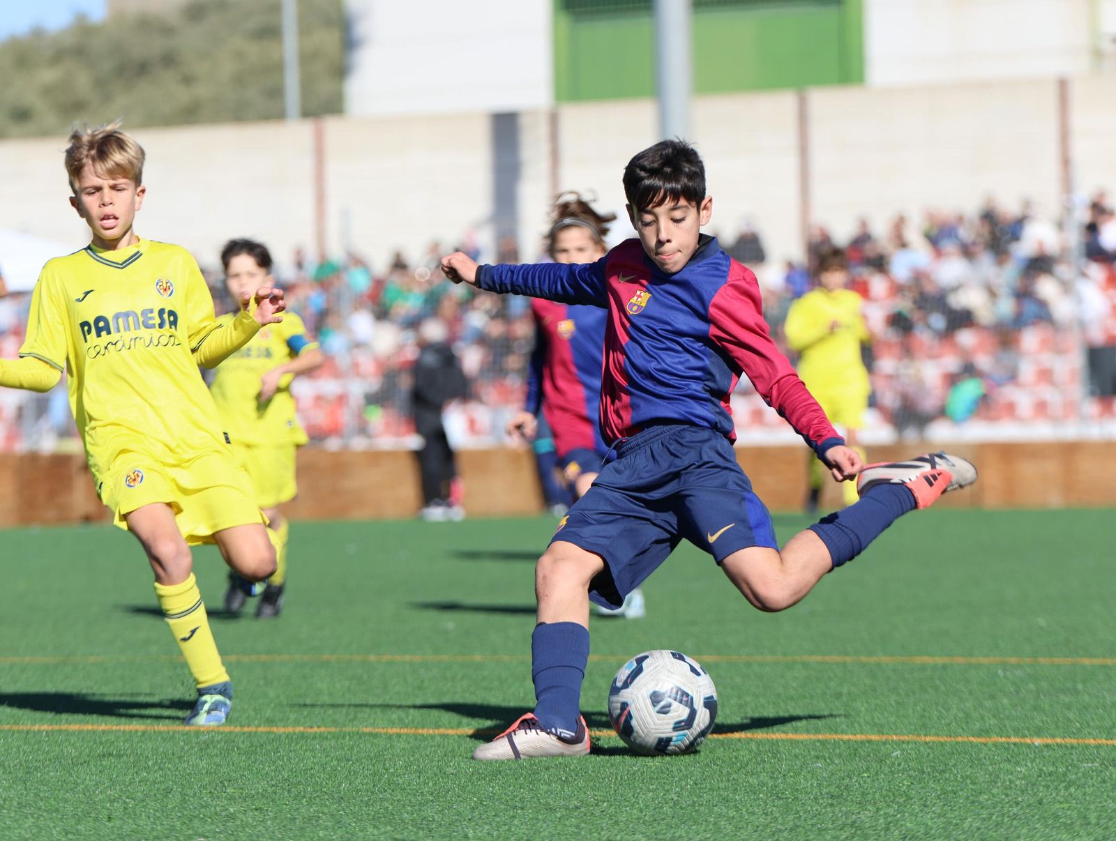 Acción de uno de los partidos de la jornada final