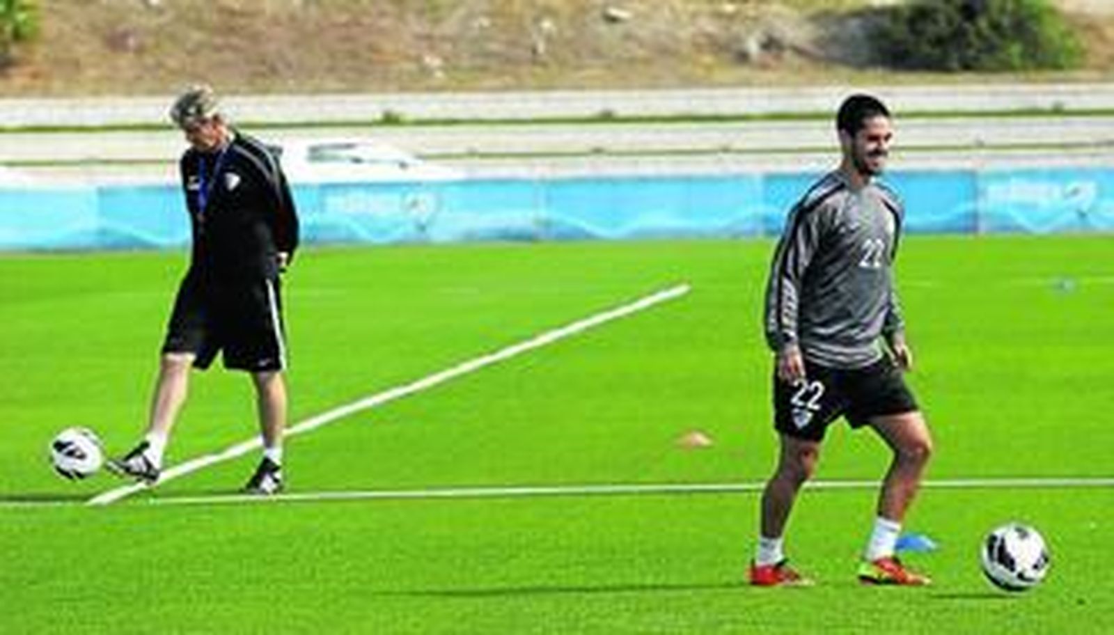 Isco y Pellegrini, en un momento del entrenamiento ayer.