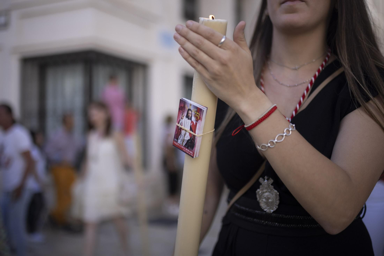 Imágenes de la salida extraordinaria de La Borriquita por las calles de Huelva