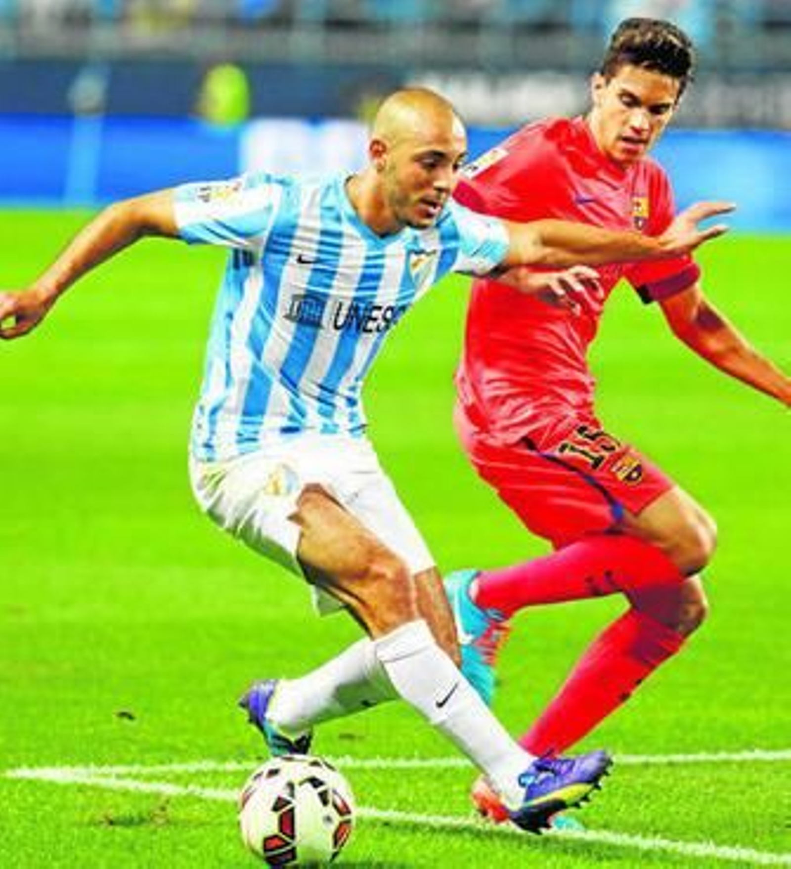 Amrabat y Bartra, en el pasado Málaga-Barça.