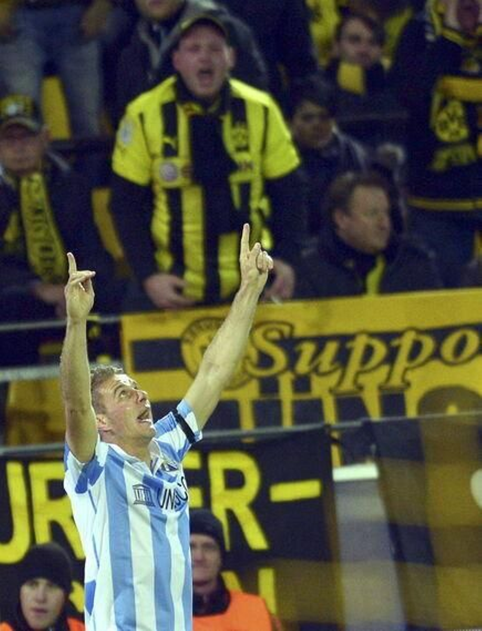Las imágenes del Borussia Dortmund-Málaga, que cumple siete años.