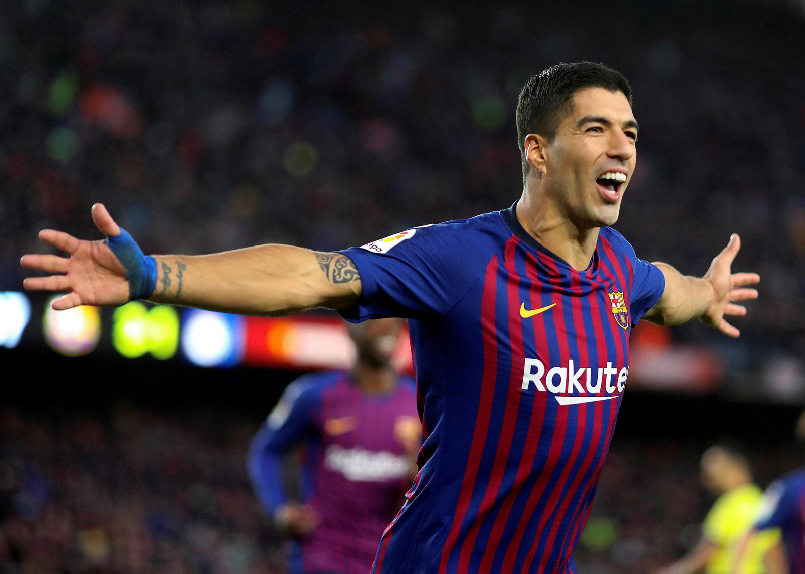 Luis Suárez celebra uno de sus goles ante el Real Madrid